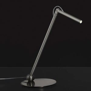 ecletty Calamaio lampada da tavolo ambientata by Oluce nickel nero satinato