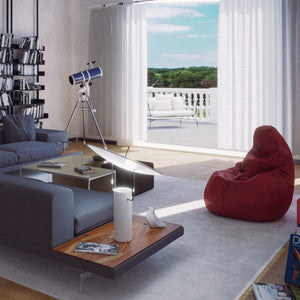 Lampada da scrivania a LED TX1 di Martinelli Luce che illumina il tavolino di un salotto di design.
