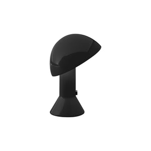 Lampada da tavolo Elmetto di Martinelli Luce, colore nero, su sfondo neutro, con diffusore orientabile.